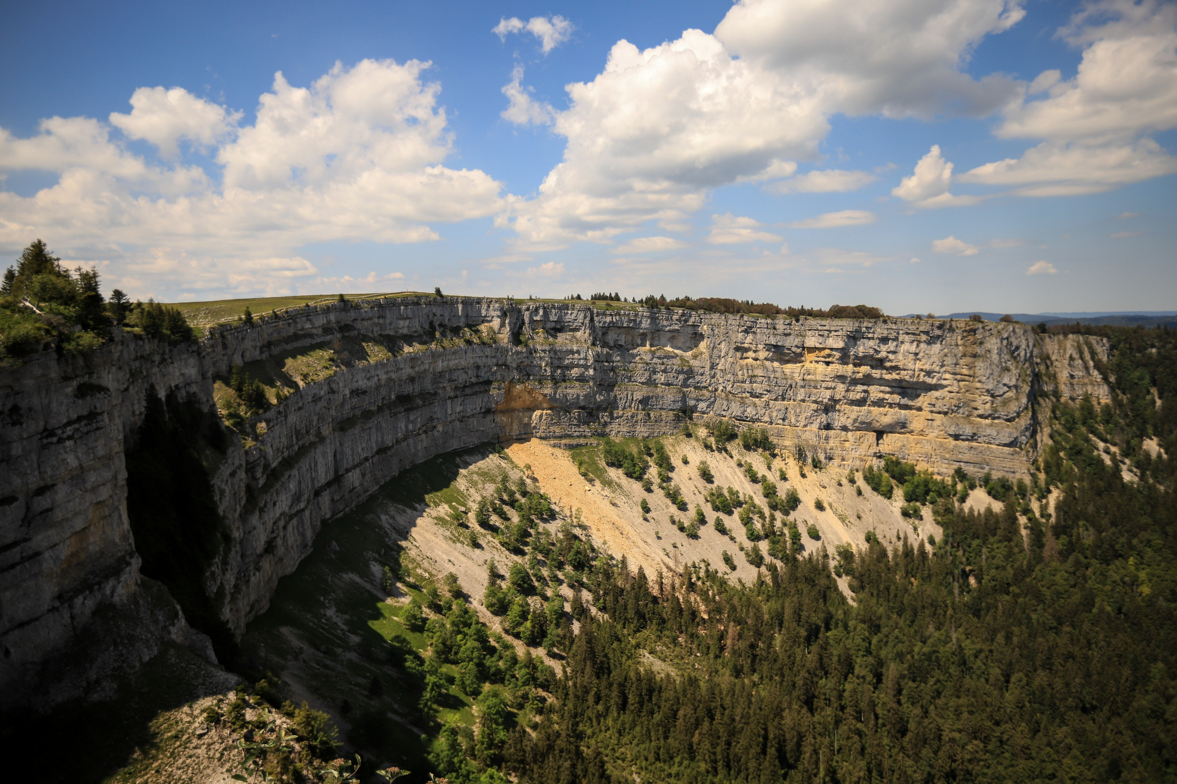 Iconic Creux du Van canyon in the Swiss Jura, Canton of Neuchâtel; Detective Agency Canton of Neuchâtel, Detective Canton of Neuchâtel, Private Detective Canton of Neuchâtel, Private Detective Agency Canton of Neuchâtel
